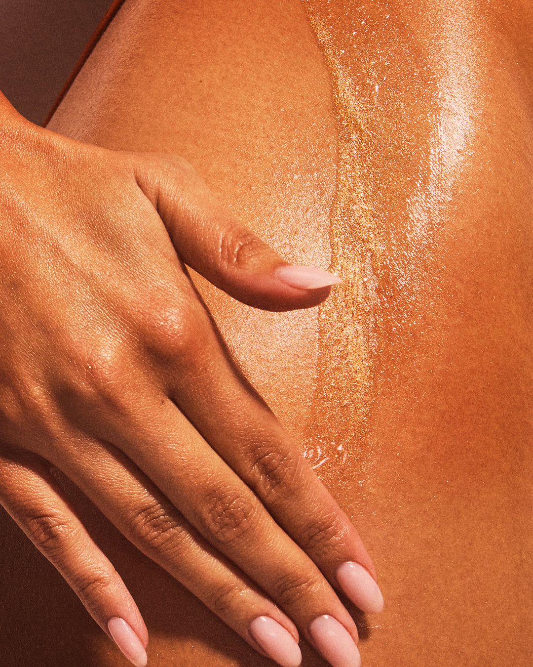 shimmer body oil on skin